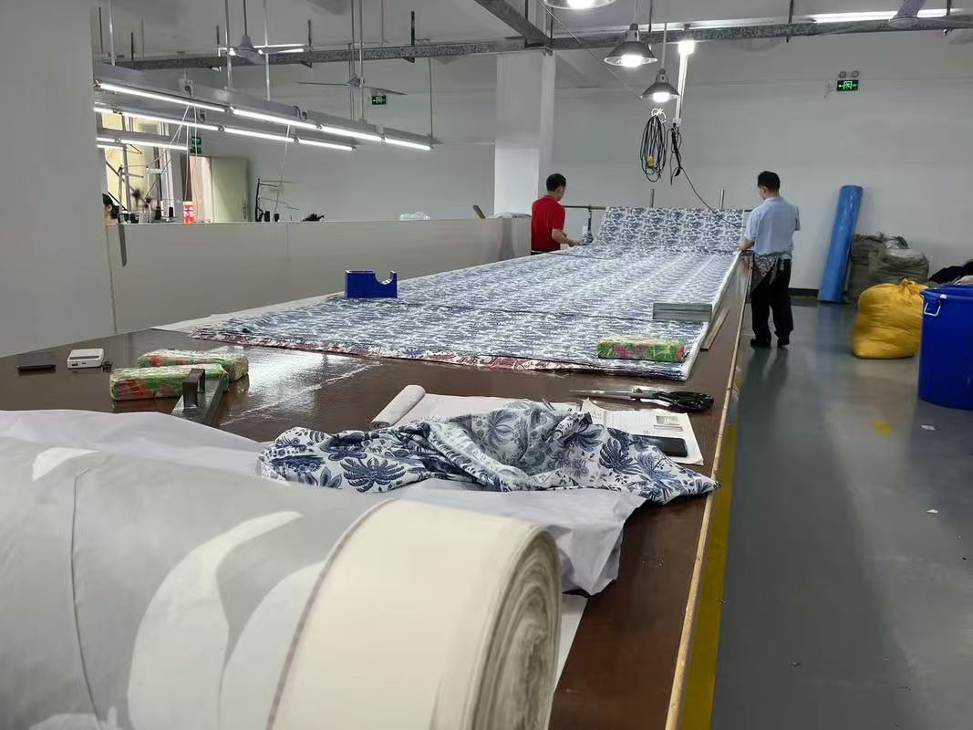 Fabric spreading before cutting for an apparel production order